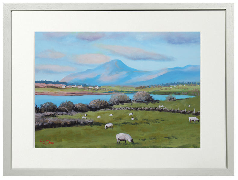 Framed artwork of a landscape with sheep, a lake, and mountains.
